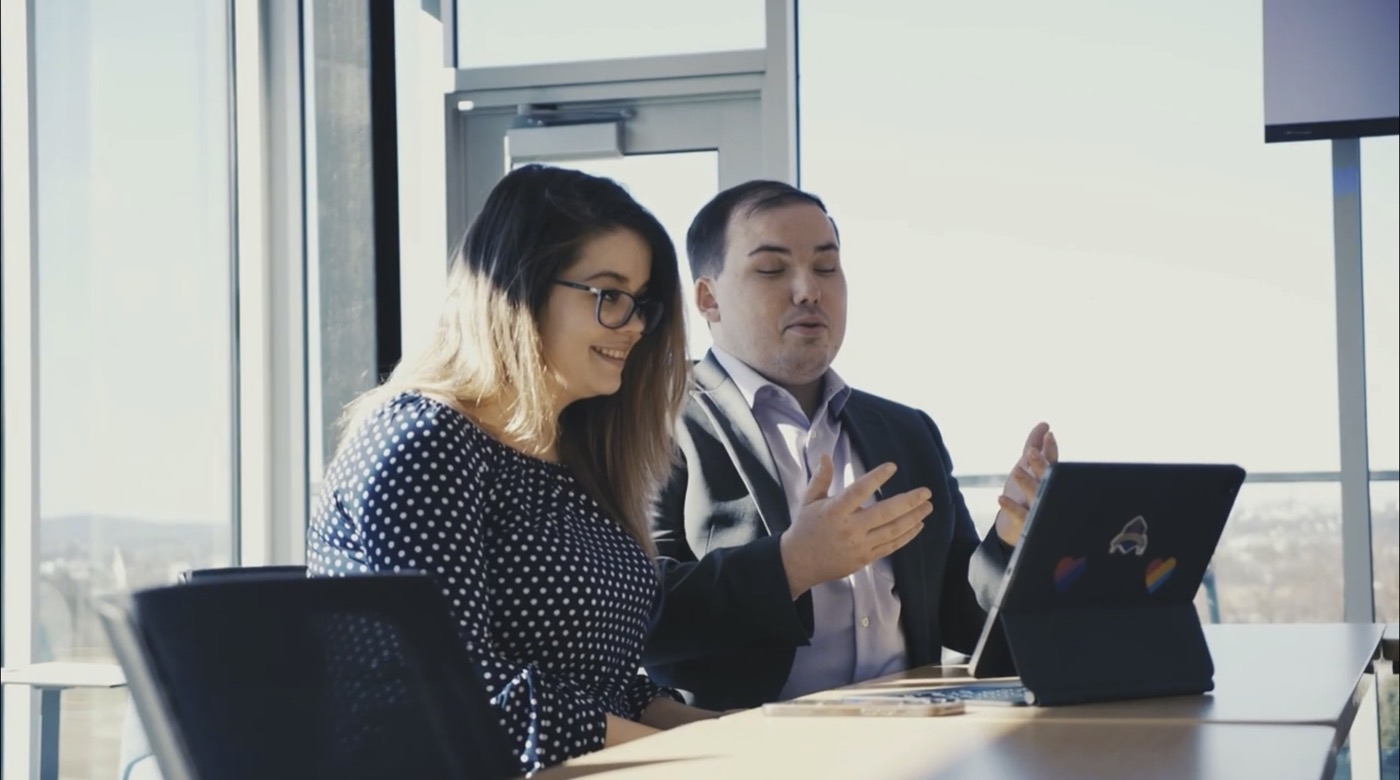 Mary Richardson and Brandon Teller working together with a tablet
