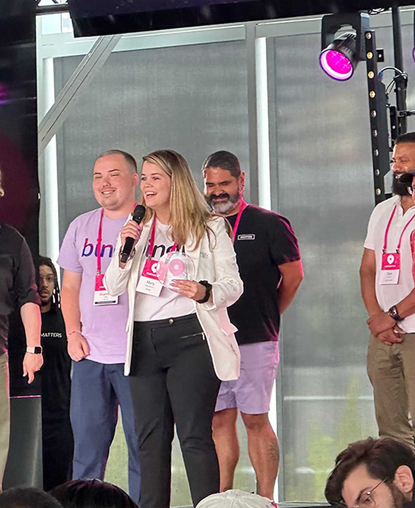 Brandon Teller and Mary Richardson on stage at Startupfest as Bindr is announced LGBTQIA+ prize winner
